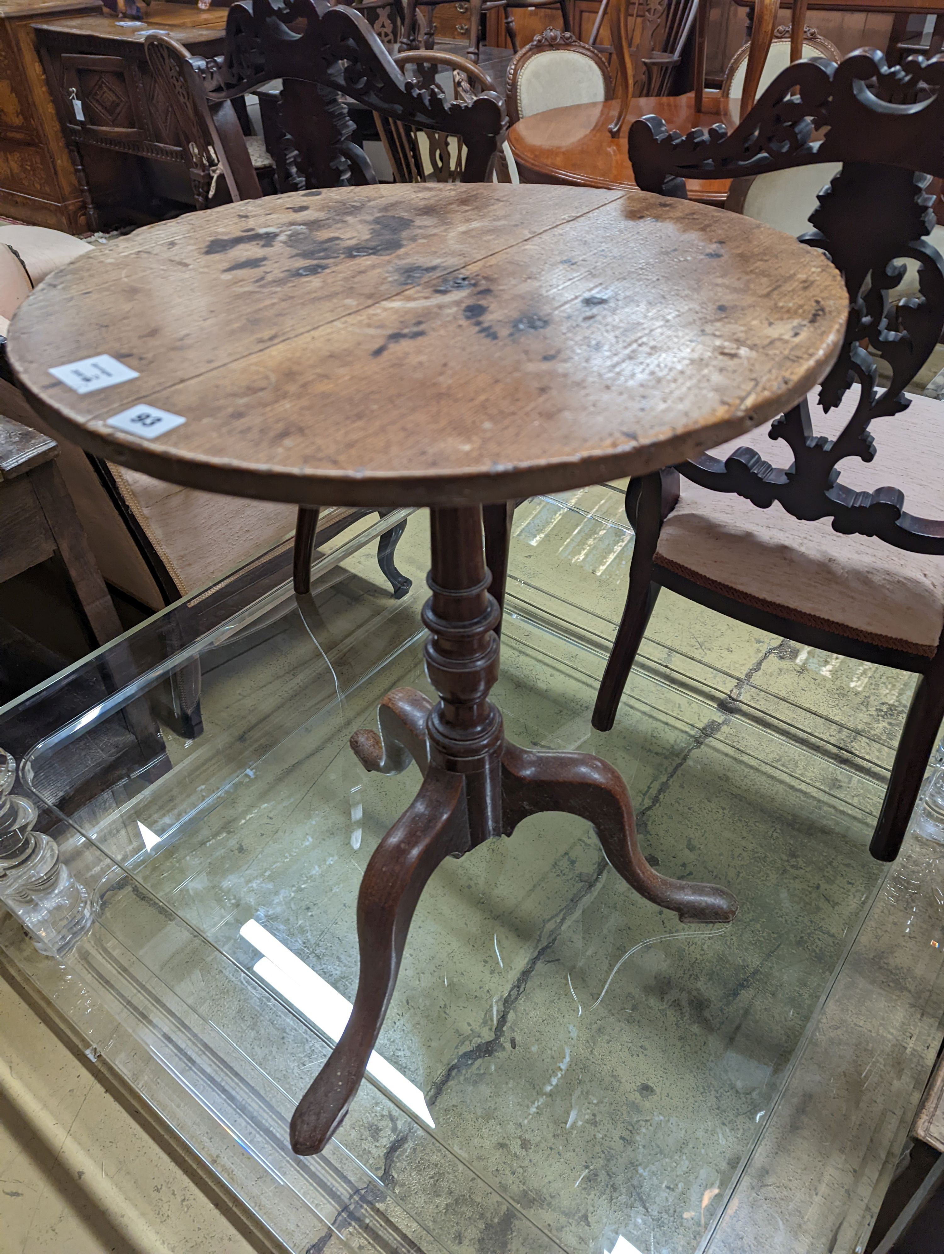 A 19th century oak stool and an oak tripod table, table diameter 53cm, 70cm height